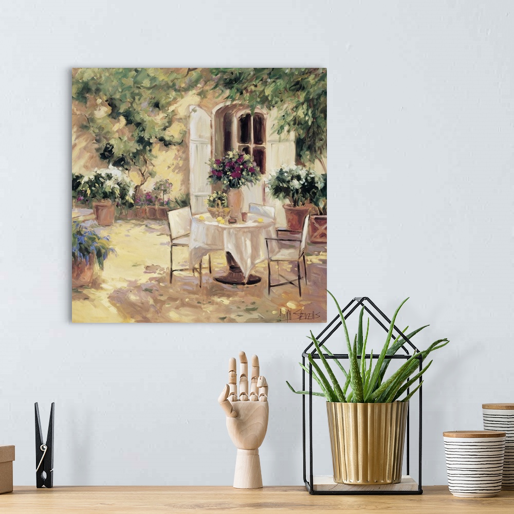 A bohemian room featuring Fine art oil painting landscape of a country villa terrace with flowering plants and a table for ...