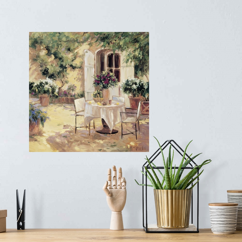 A bohemian room featuring Fine art oil painting landscape of a country villa terrace with flowering plants and a table for ...