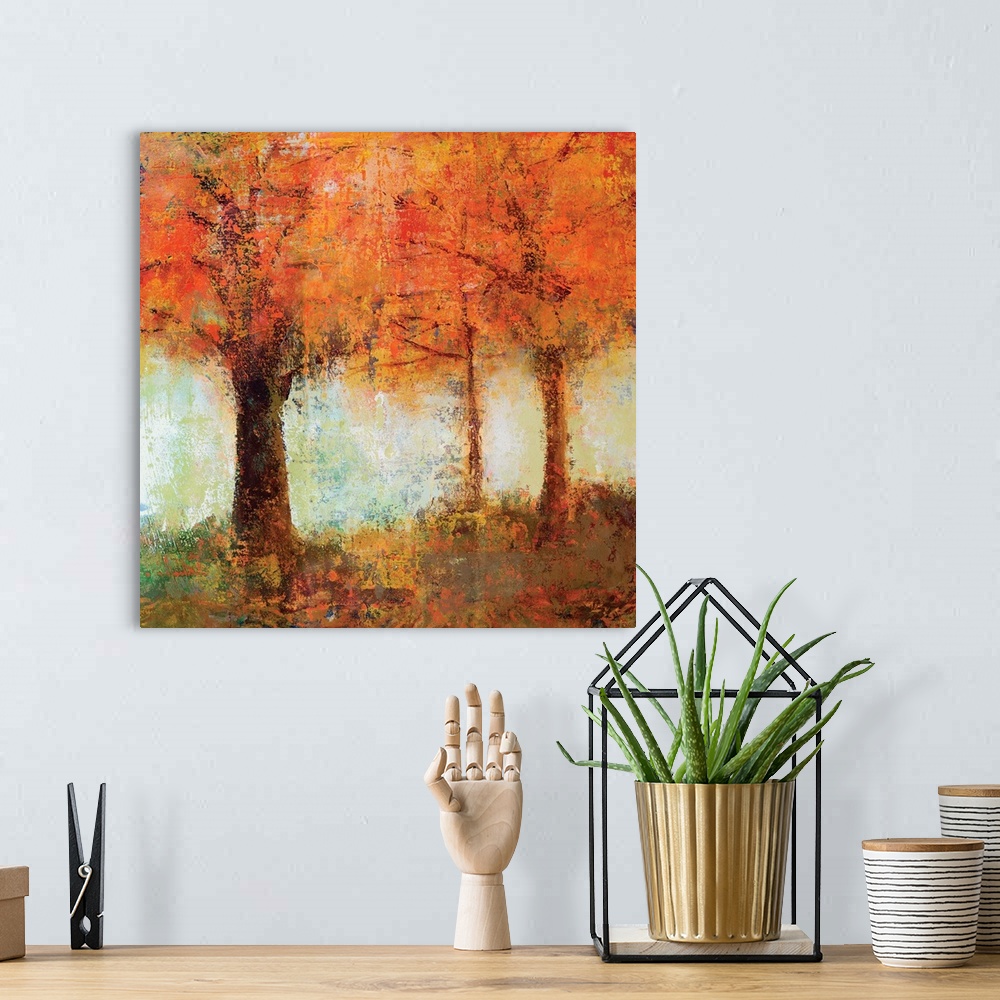 A bohemian room featuring Contemporary artwork of brightly colored fall trees against a soft pale green sky.