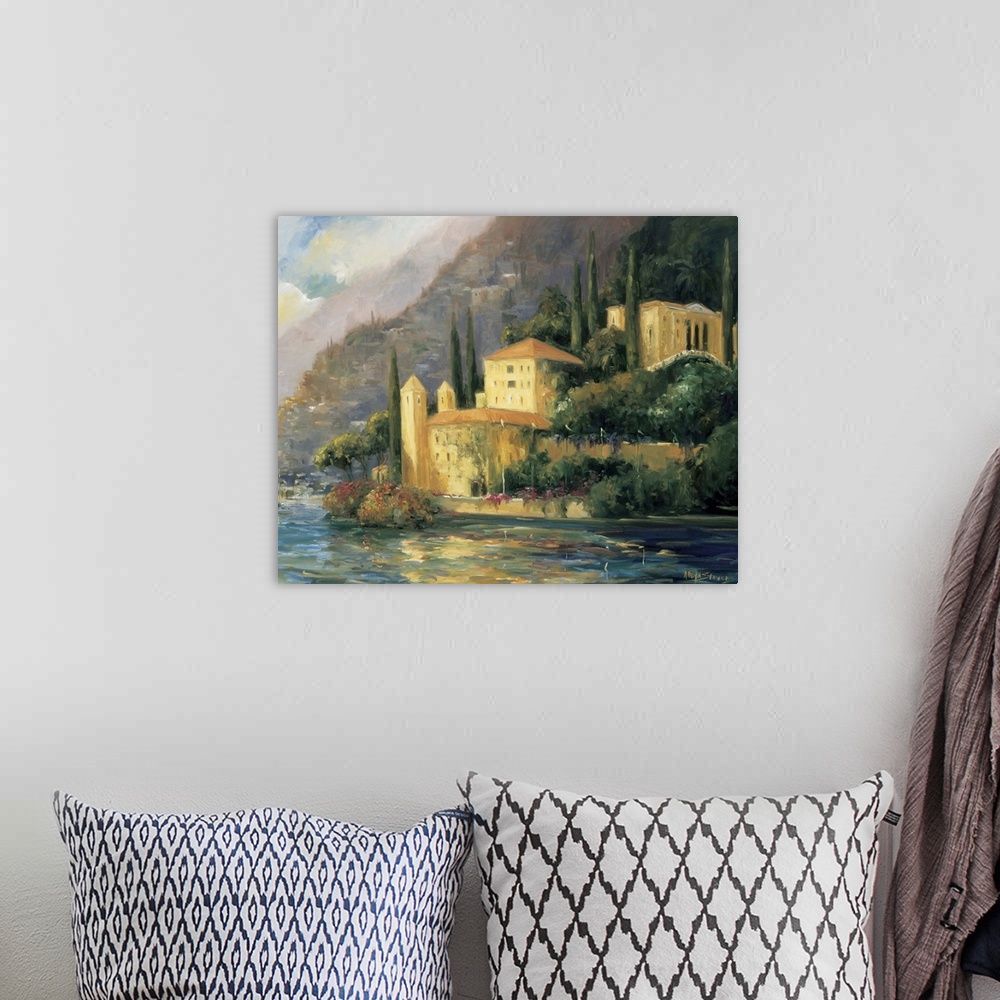 A bohemian room featuring Painting of a villa on the water's edge in Italy.
