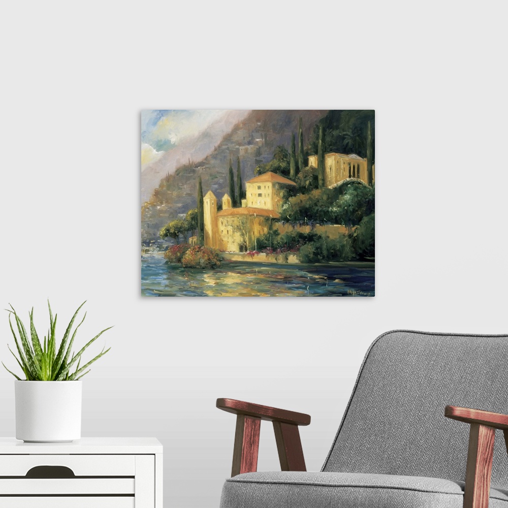 A modern room featuring Painting of a villa on the water's edge in Italy.