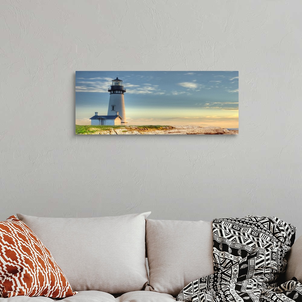 A bohemian room featuring Photograph of a lighthouse against a blue sky.