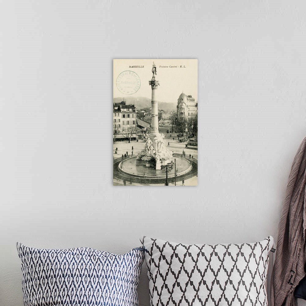 A bohemian room featuring Vintage postcard of a monument in Marseille, France.