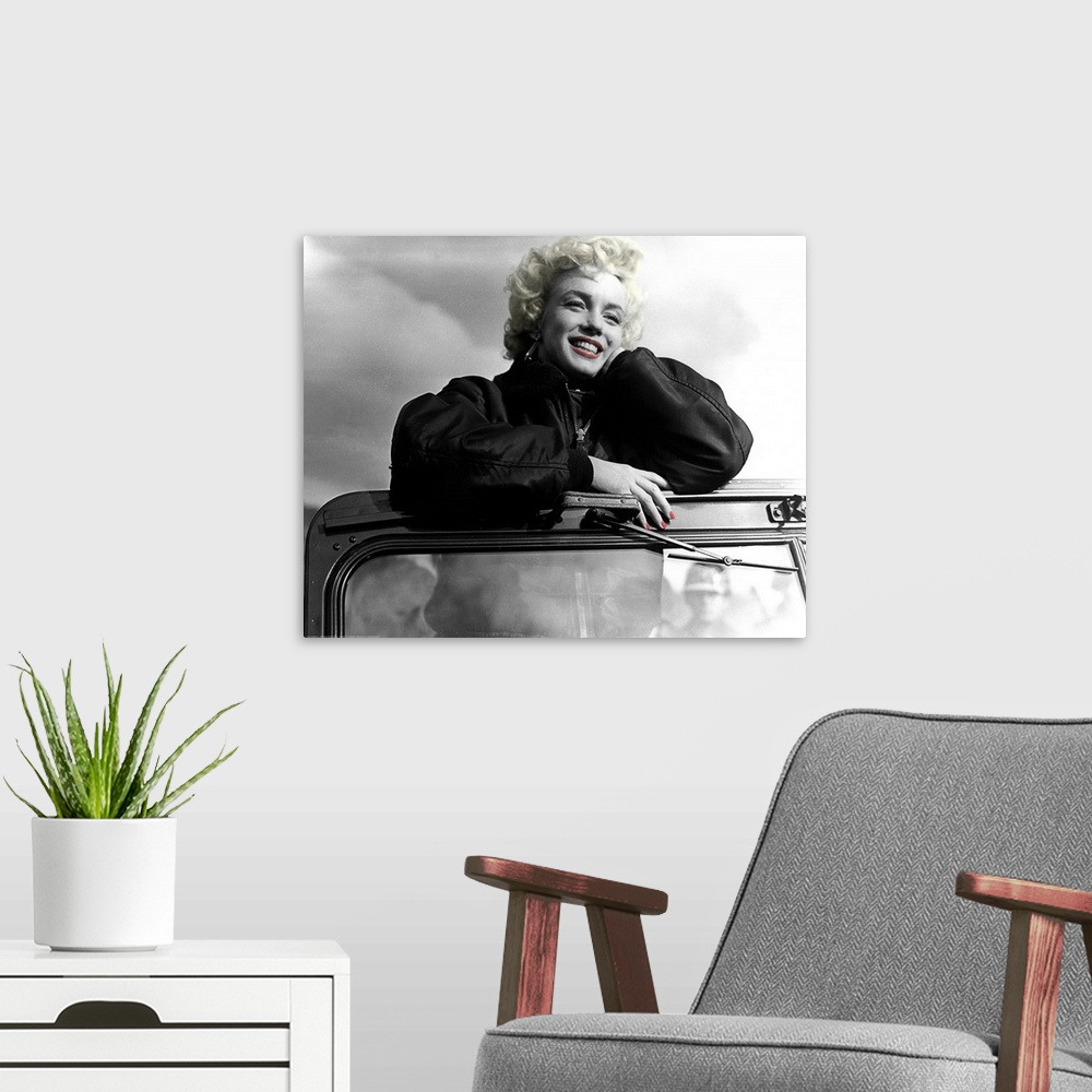 A modern room featuring Photograph with color tint highlights of Marilyn Monroe's favorite shot from entertaining the tro...