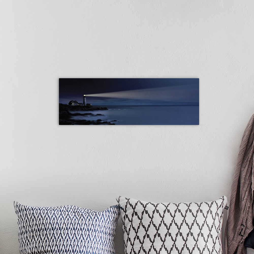 A bohemian room featuring Digital art painting of a lighthouse shining over the sea.