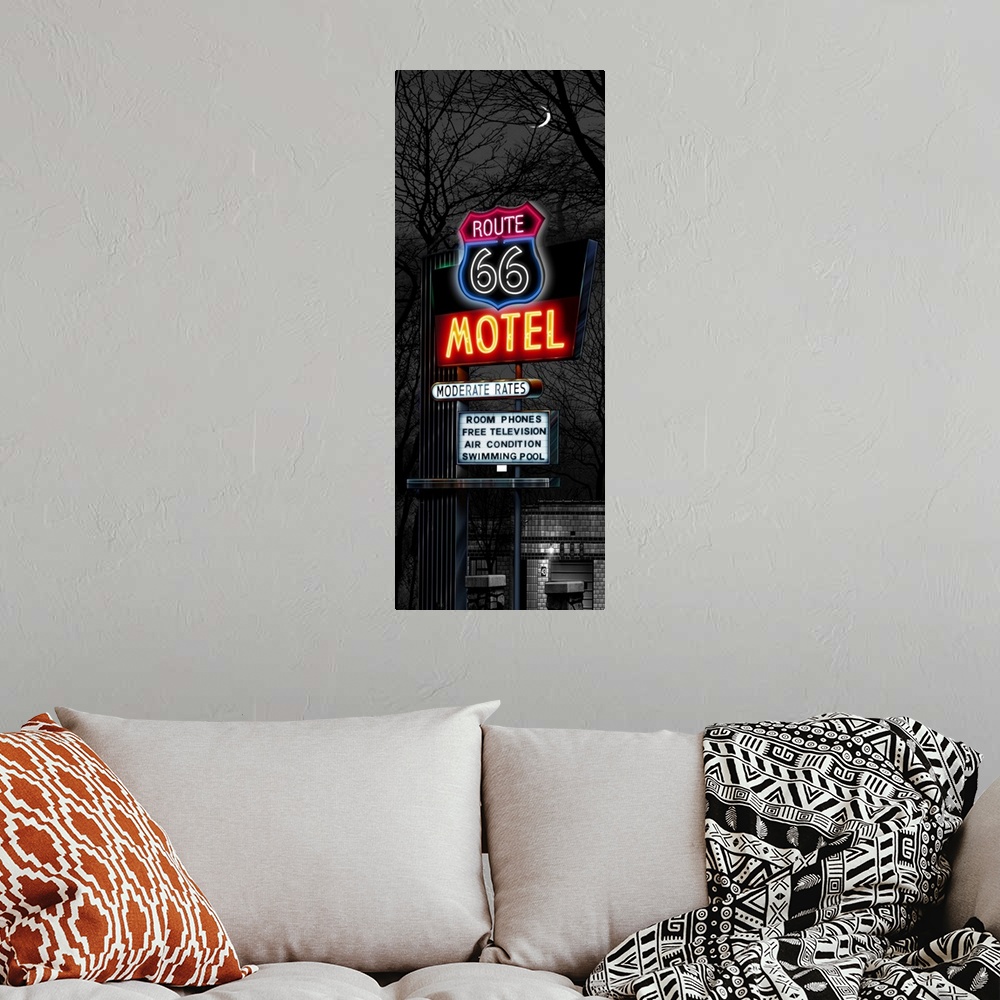 A bohemian room featuring Digital art painting in black and white with some color of the Route 66 Motel sign at night.