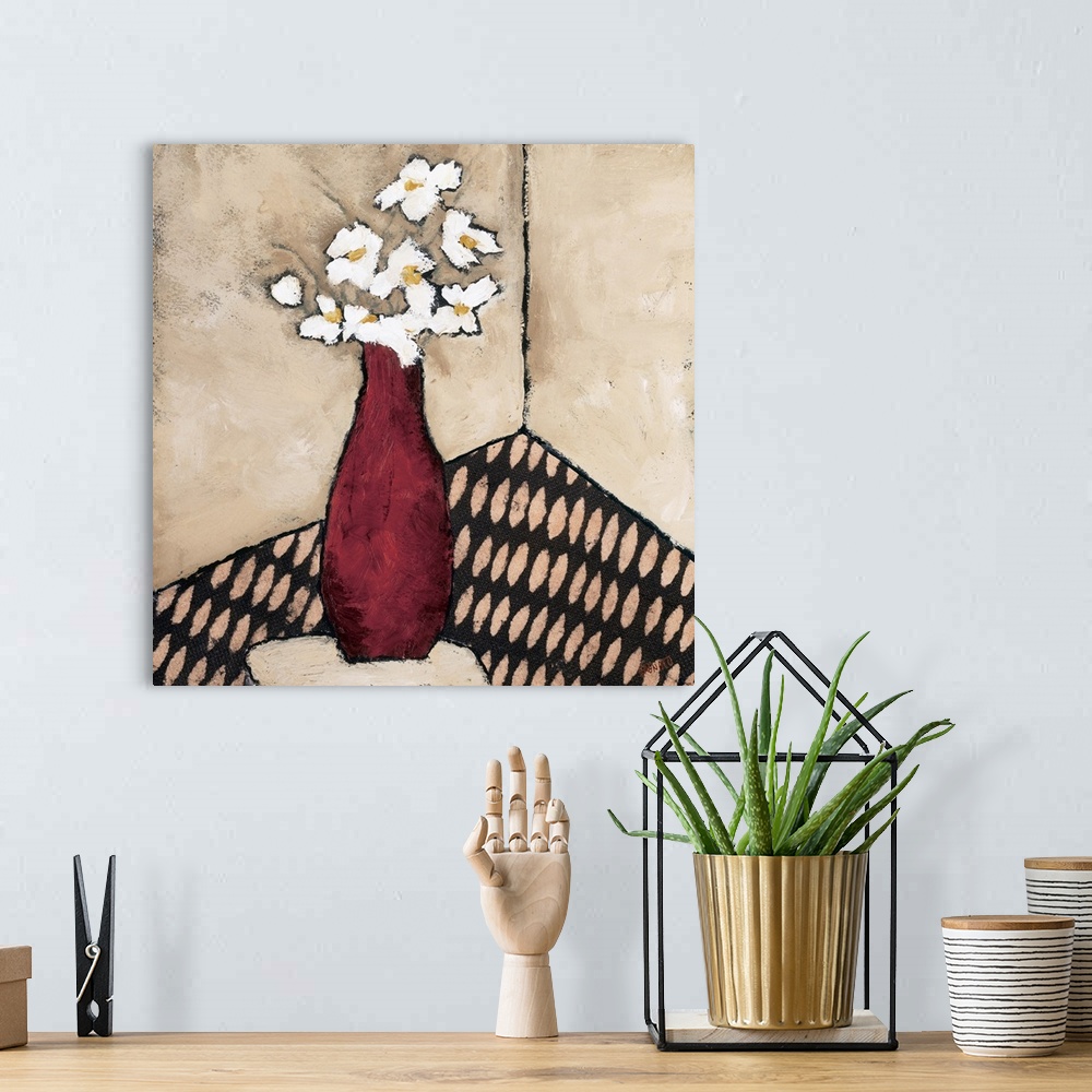 A bohemian room featuring Contemporary painting of a bouquet of white flowers in a red vase.