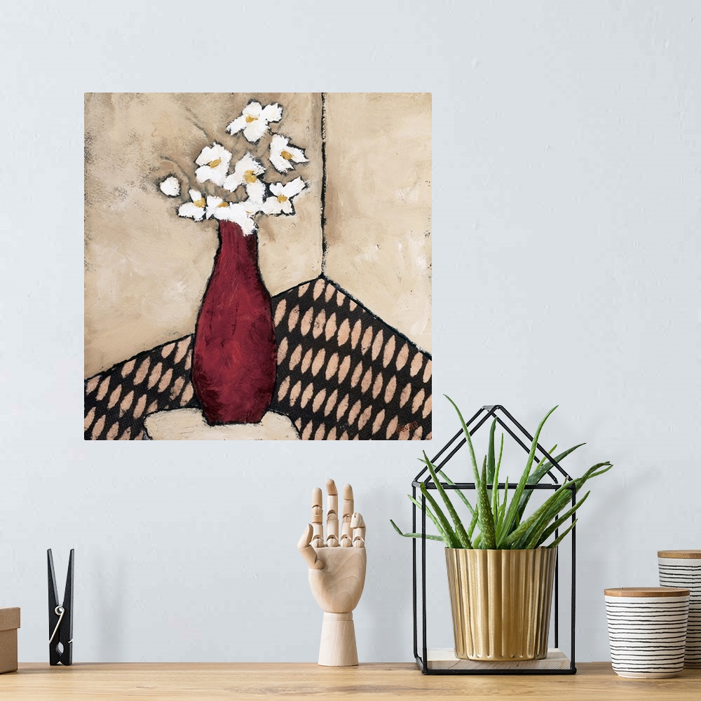 A bohemian room featuring Contemporary painting of a bouquet of white flowers in a red vase.