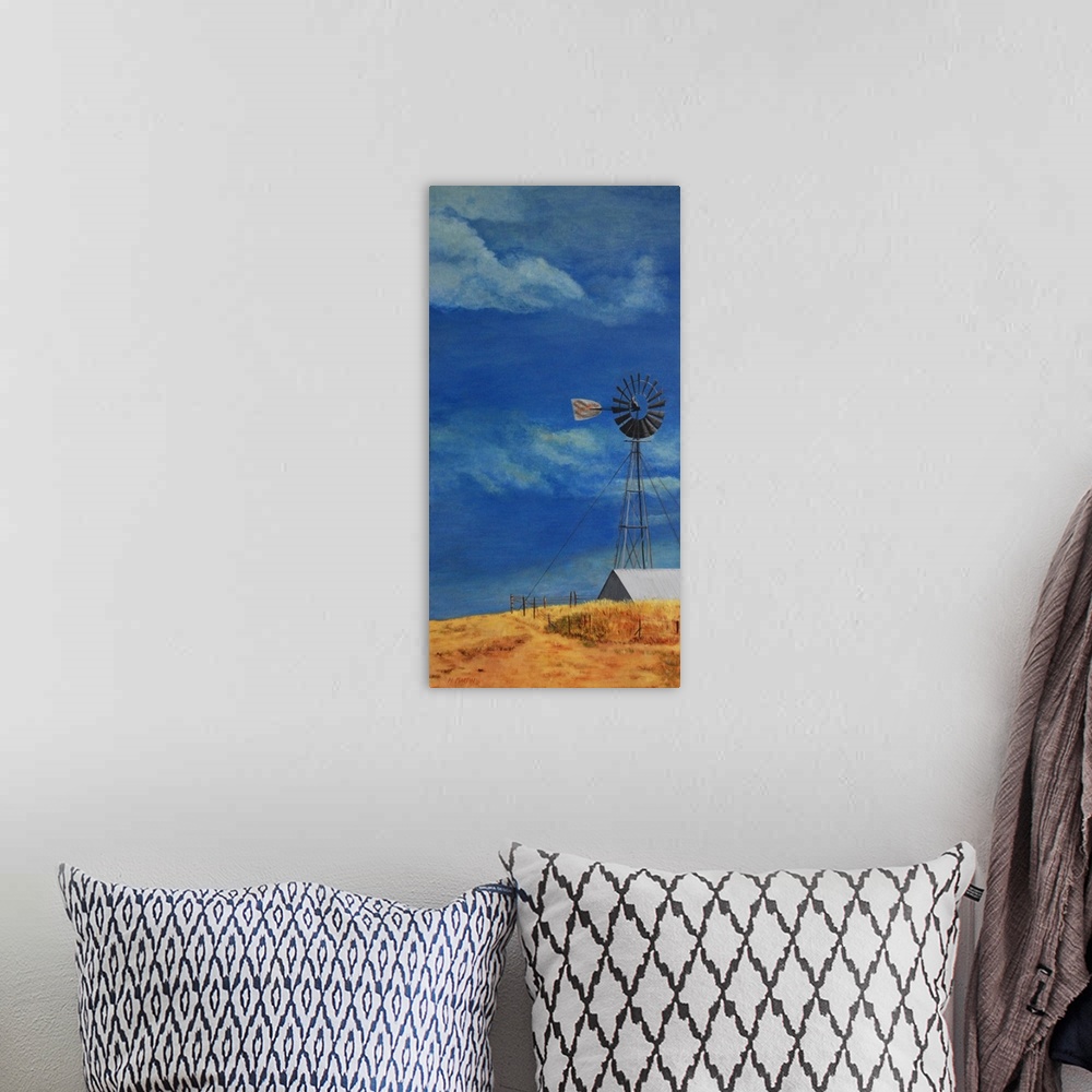 A bohemian room featuring Painting of a windmill on a farm against a blue sky.