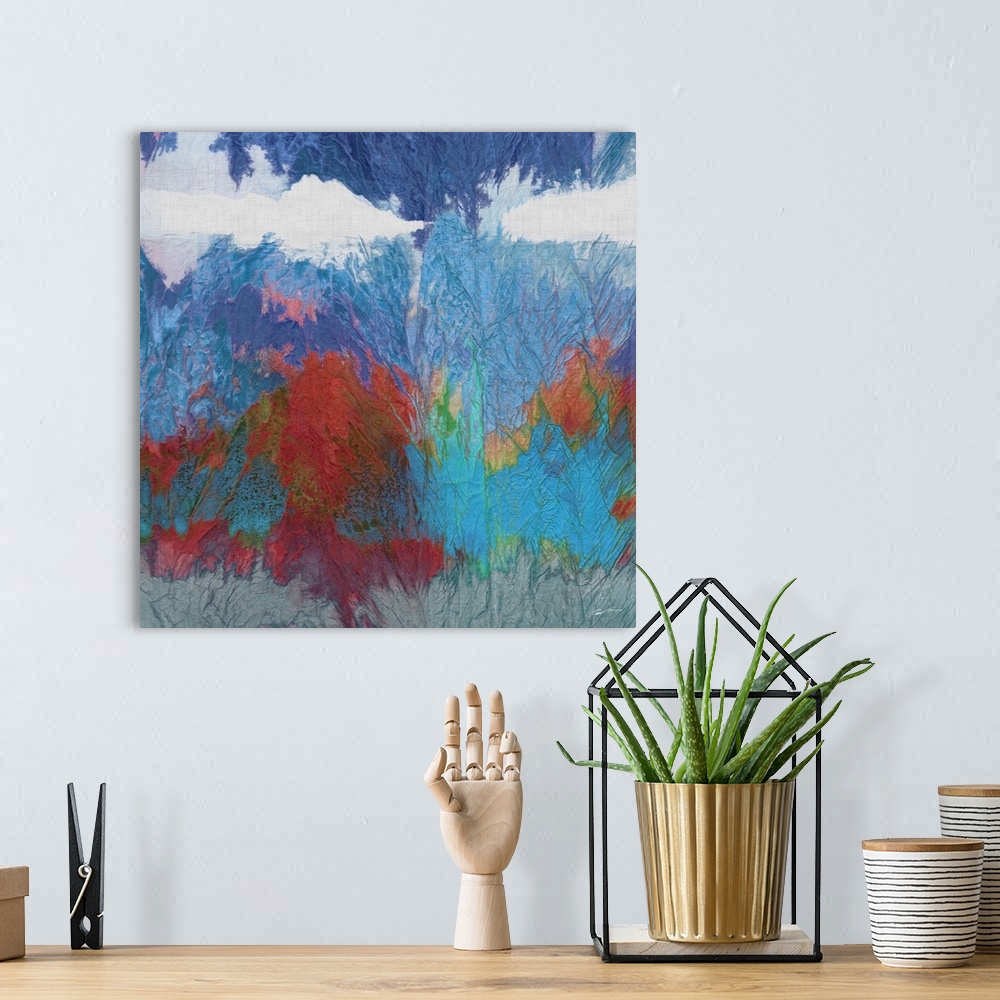 A bohemian room featuring Abstract watercolor landscape in deep rich colors.