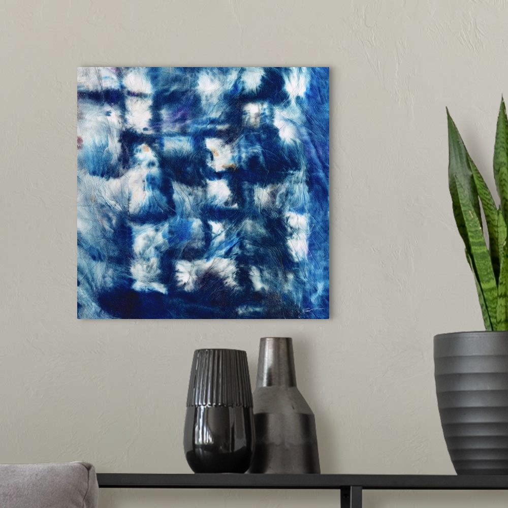 A modern room featuring Shibori folds of indigo step across the canvas.
