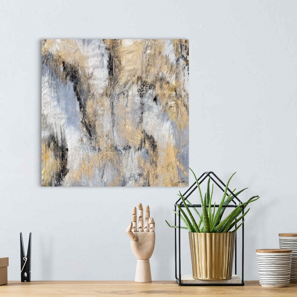 A bohemian room featuring An abstract marbleized print with golden highlights.
