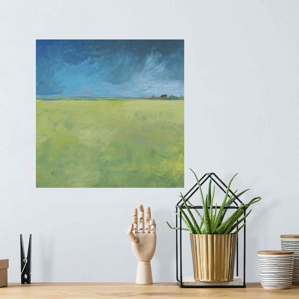 A bohemian room featuring a minimal landscape on wood panel in acrylic. Green fields glow in fresh citrus colors after a he...