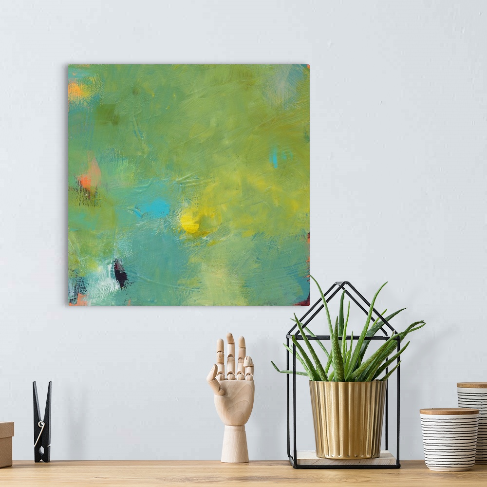 A bohemian room featuring A contemporary abstract painting with shades of green, yellow, and blue on top and hints of orang...