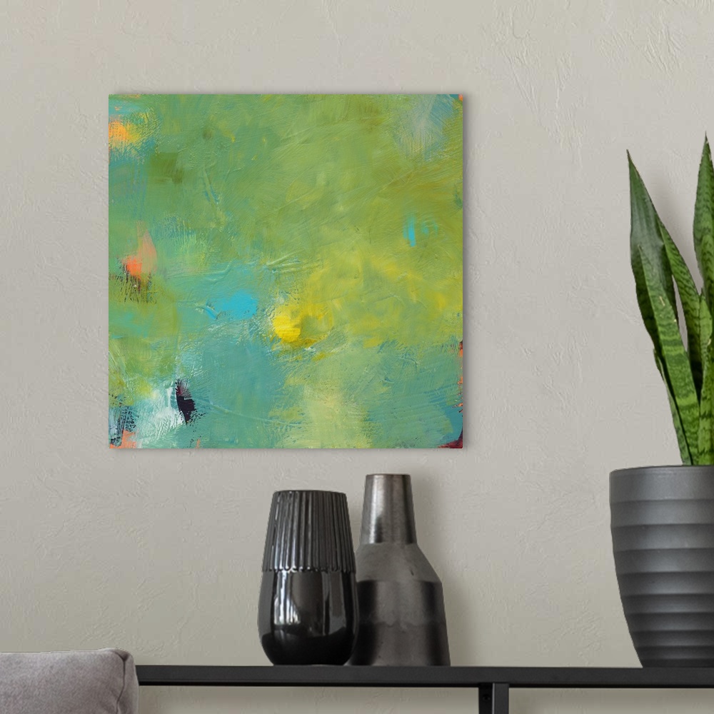 A modern room featuring A contemporary abstract painting with shades of green, yellow, and blue on top and hints of orang...