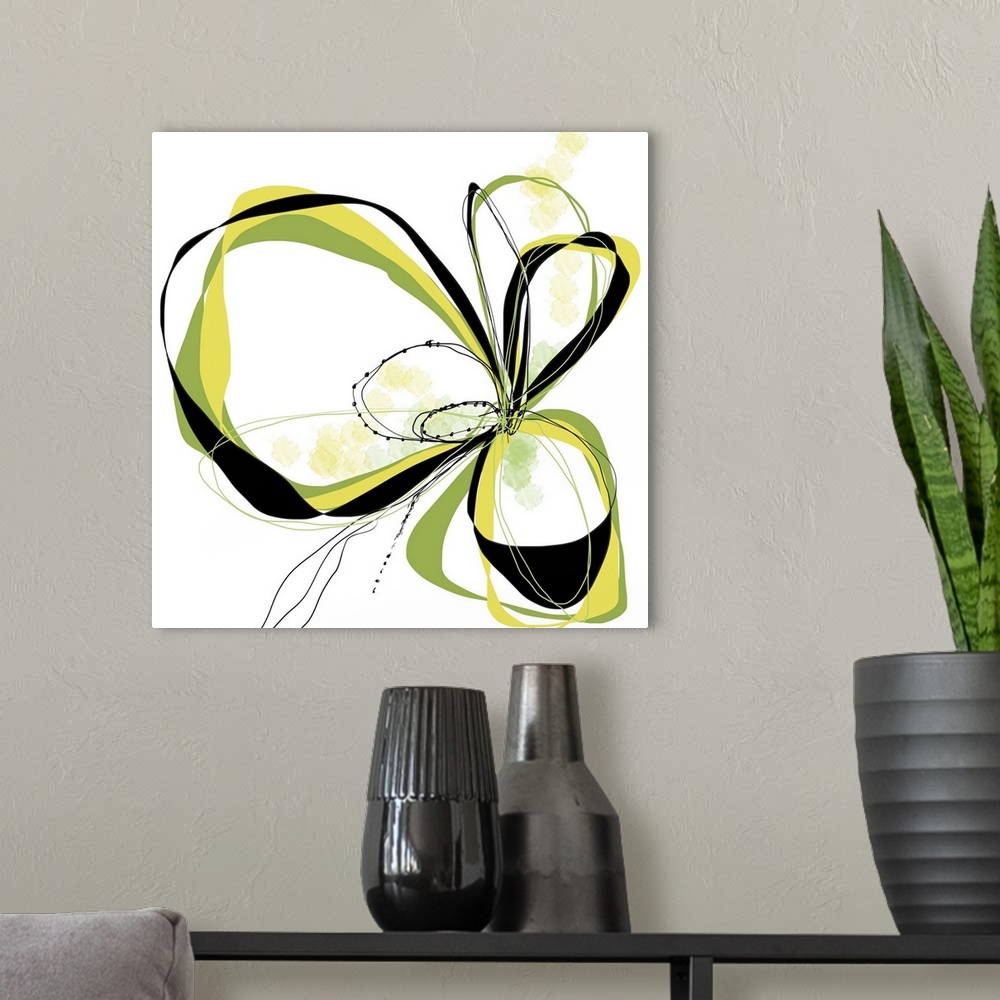 A modern room featuring a bright floral with flowing lines of intertwined colors like yellow, citron and black.