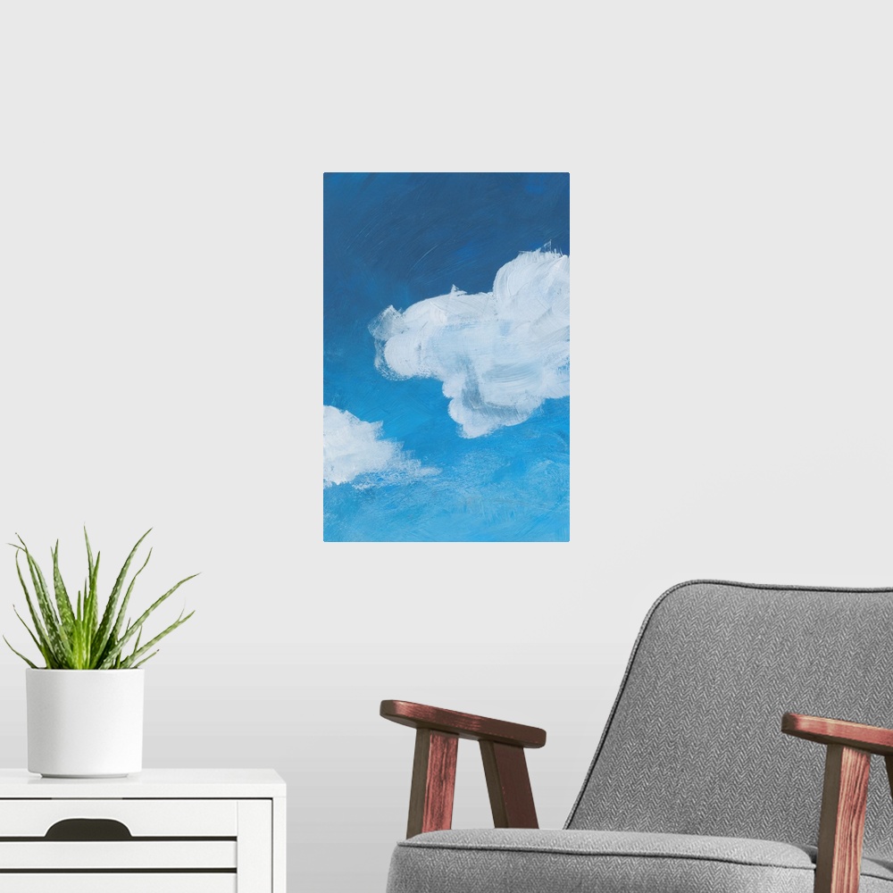 A modern room featuring Contemporary artwork of fluffy white clouds against a gradated blue background.