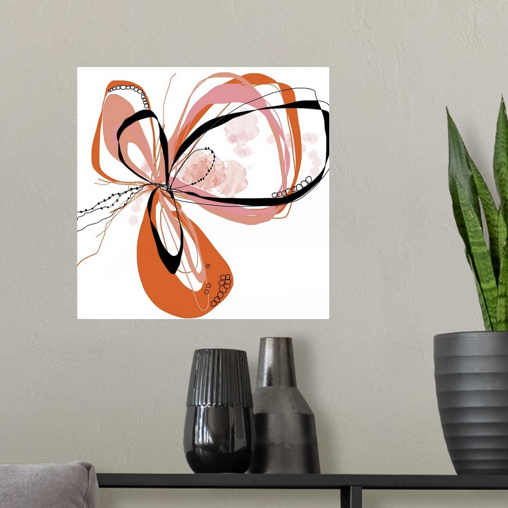 A modern room featuring a bright floral with flowing lines of intertwined colors like coral, pink, orange and black.