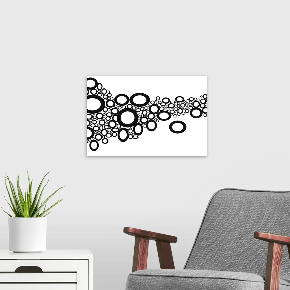 A modern room featuring Digital art of dark circles and ovals that represent the rocks in a dry creek bed.