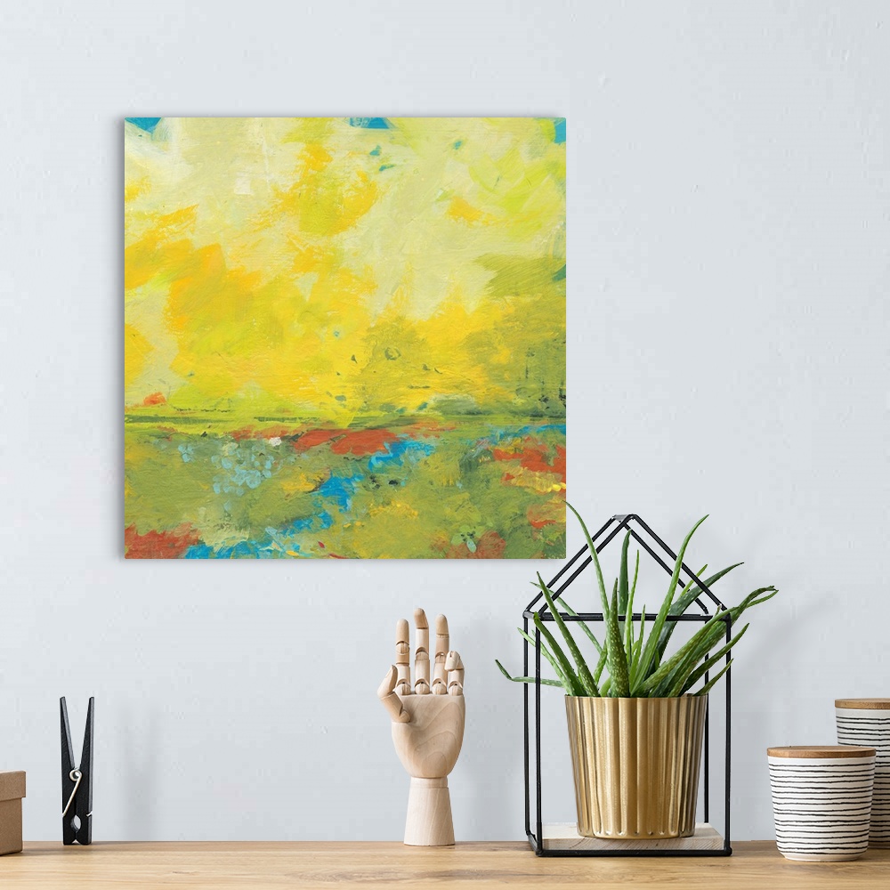 A bohemian room featuring Giant, square abstract painting of earth and sky meeting.  Golden warm colors of the sky meet a h...