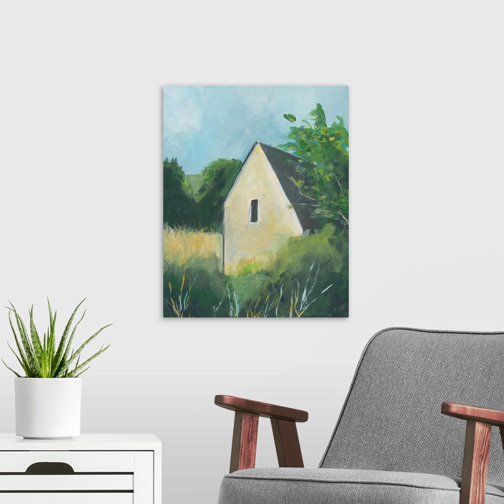 A modern room featuring Vertical painting of a yellow house surround by trees in the country.