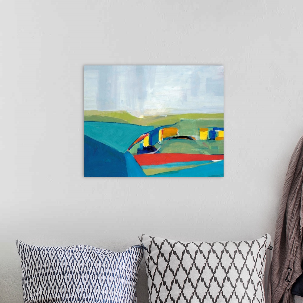 A bohemian room featuring Abstract landscape of rolling hills in multiple colors such as blue, green, red, and yellow.
