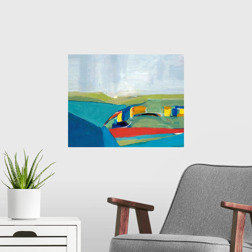 A modern room featuring Abstract landscape of rolling hills in multiple colors such as blue, green, red, and yellow.