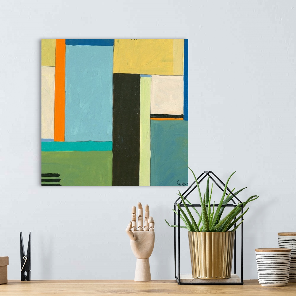 A bohemian room featuring An acrylic painting on archival matboard. Geometric shapes meeting together.
