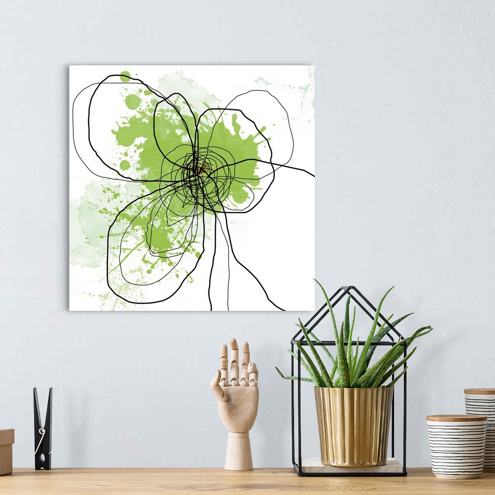 A bohemian room featuring Oversized, square, abstract art of the outline of a flower illustrated with squiggly black lines ...