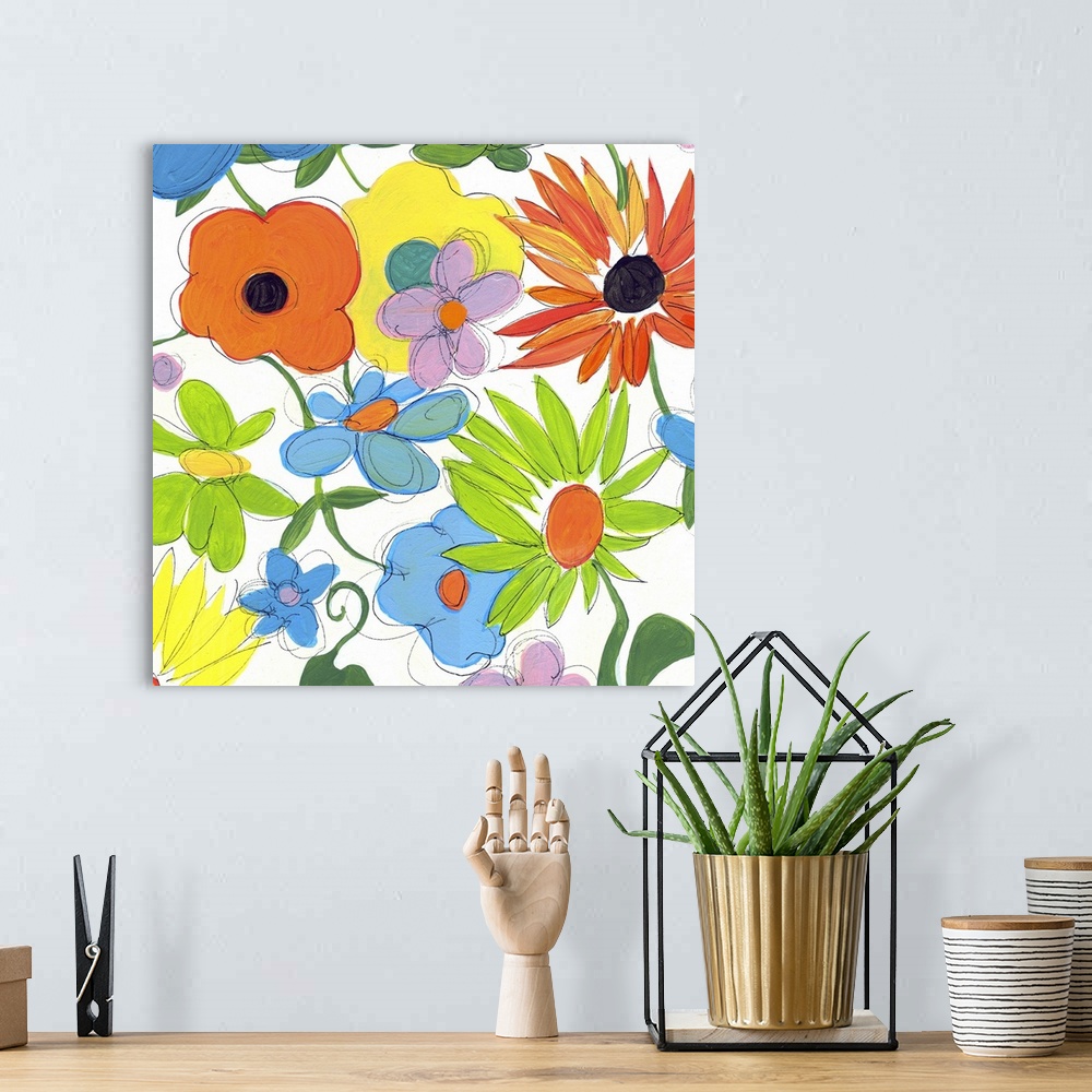 A bohemian room featuring Bright painting of different flowers on a square white canvas.