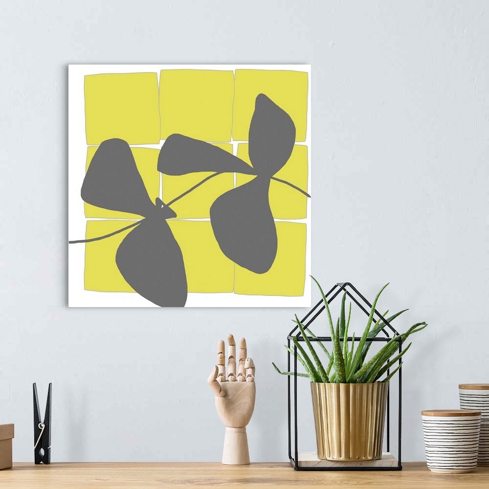 A bohemian room featuring Modern art vector display of bright yellow squares and a grey silhouettes of leaves running throu...