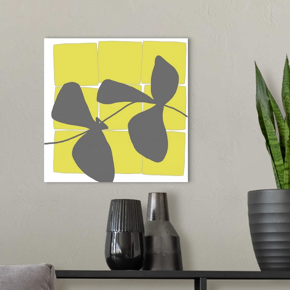 A modern room featuring Modern art vector display of bright yellow squares and a grey silhouettes of leaves running throu...