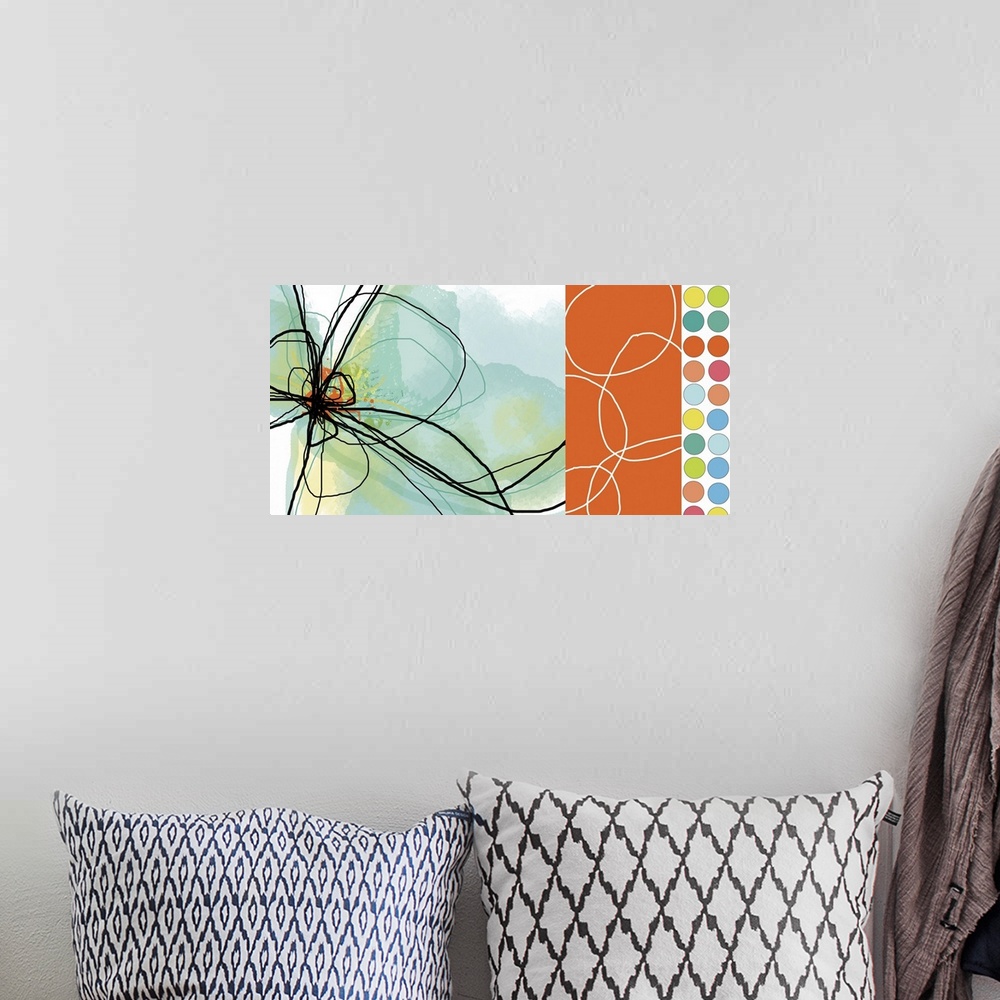 A bohemian room featuring Abstract canvas print of the outline of a flower on the left and multicolored polka dots on the r...