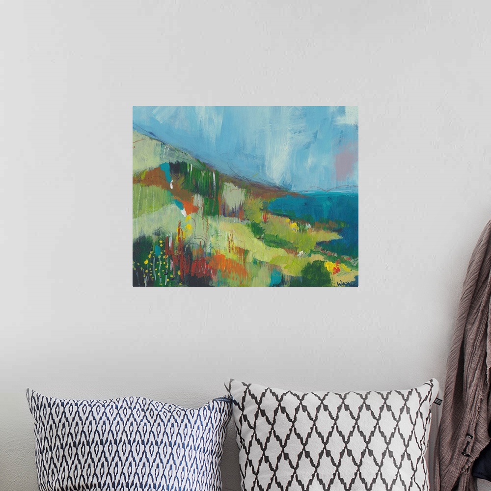 A bohemian room featuring Abstract landscape painting of the pacific coast done if varies shades of green and blue.