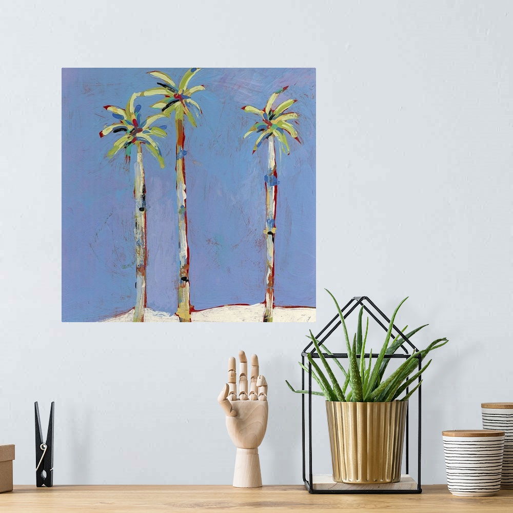 A bohemian room featuring Square, contemporary painting of three tall palm trees against a background of blue. Painted with...