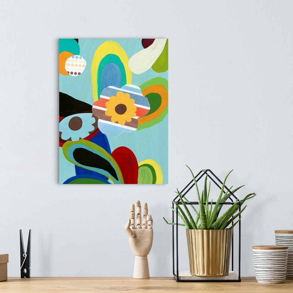 A bohemian room featuring Big, vertical retro painting of a small flower in the middle with striped, multi-colored petals, ...