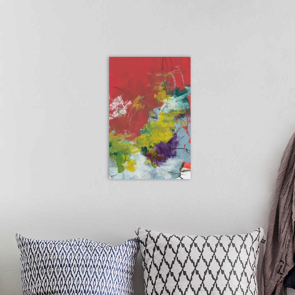 A bohemian room featuring Abstract contemporary artwork of quick brushstrokes in yellow, red, and purple.