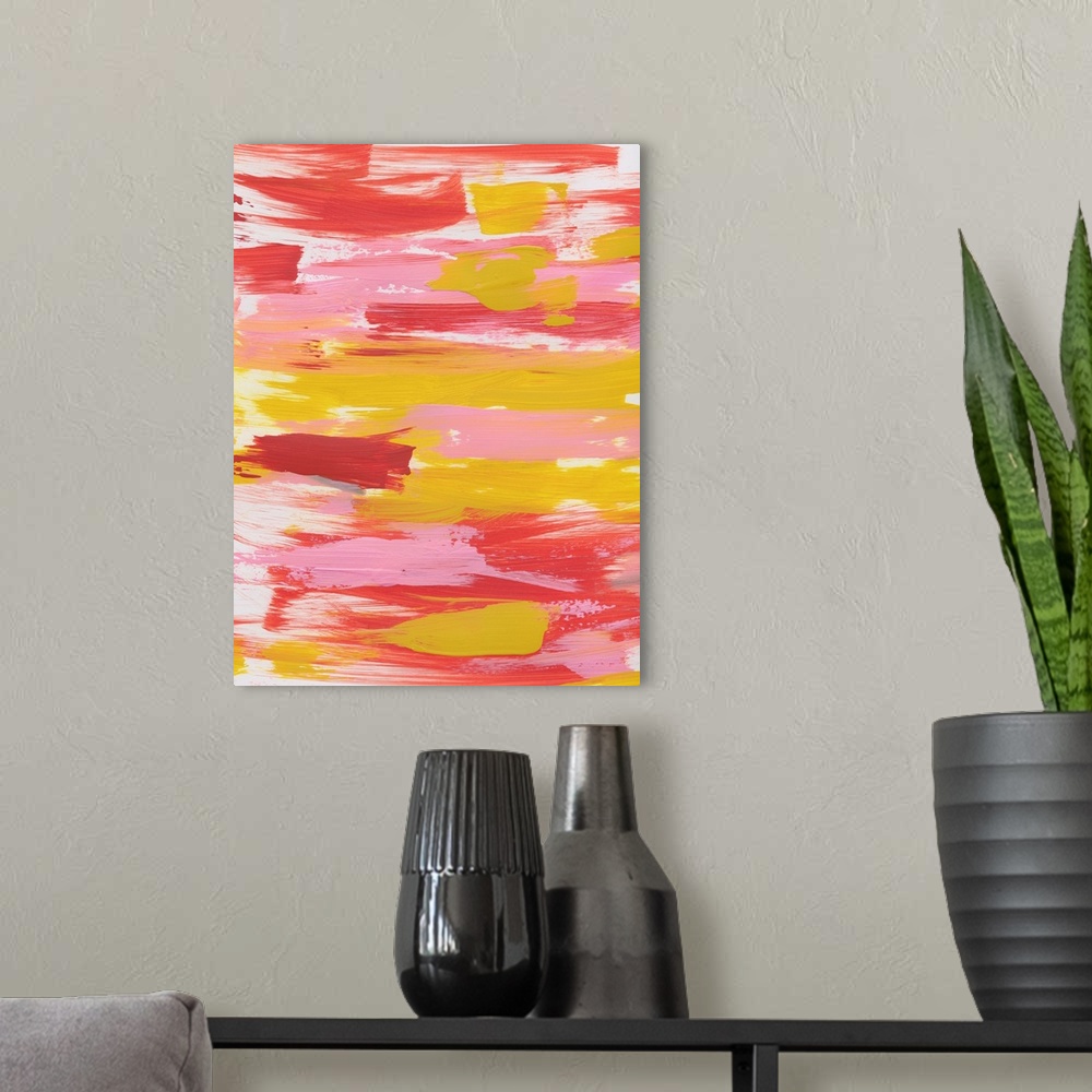 A modern room featuring Vertical abstract painting of sweeping horizontal brush strokes in yellow, pink and red.