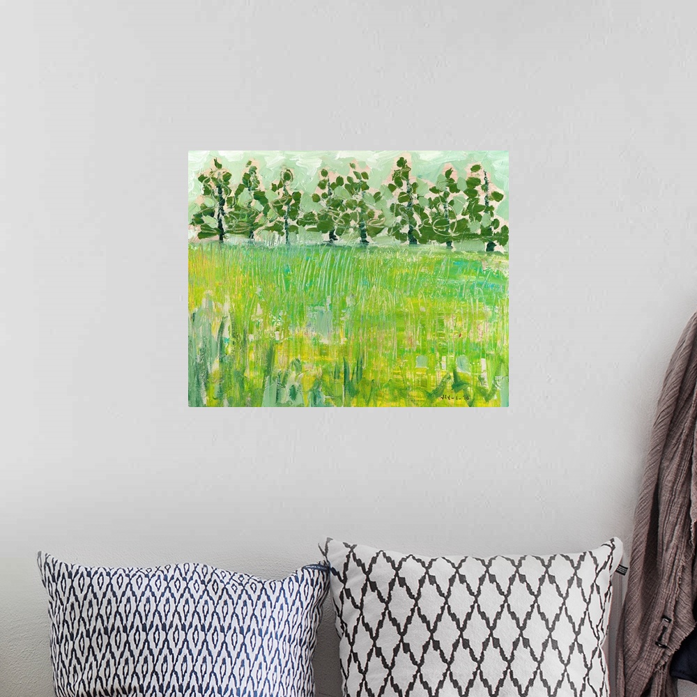 A bohemian room featuring This large painting consists of a field with the grass painted in various textures and darker tre...