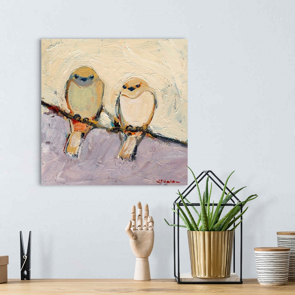 A bohemian room featuring This is a square shaped canvas is a painting of two birds sitting together on a branch.
