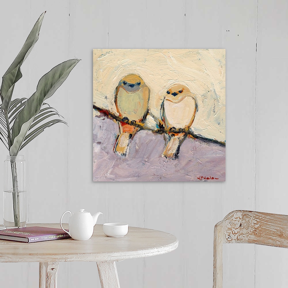 A farmhouse room featuring This is a square shaped canvas is a painting of two birds sitting together on a branch.