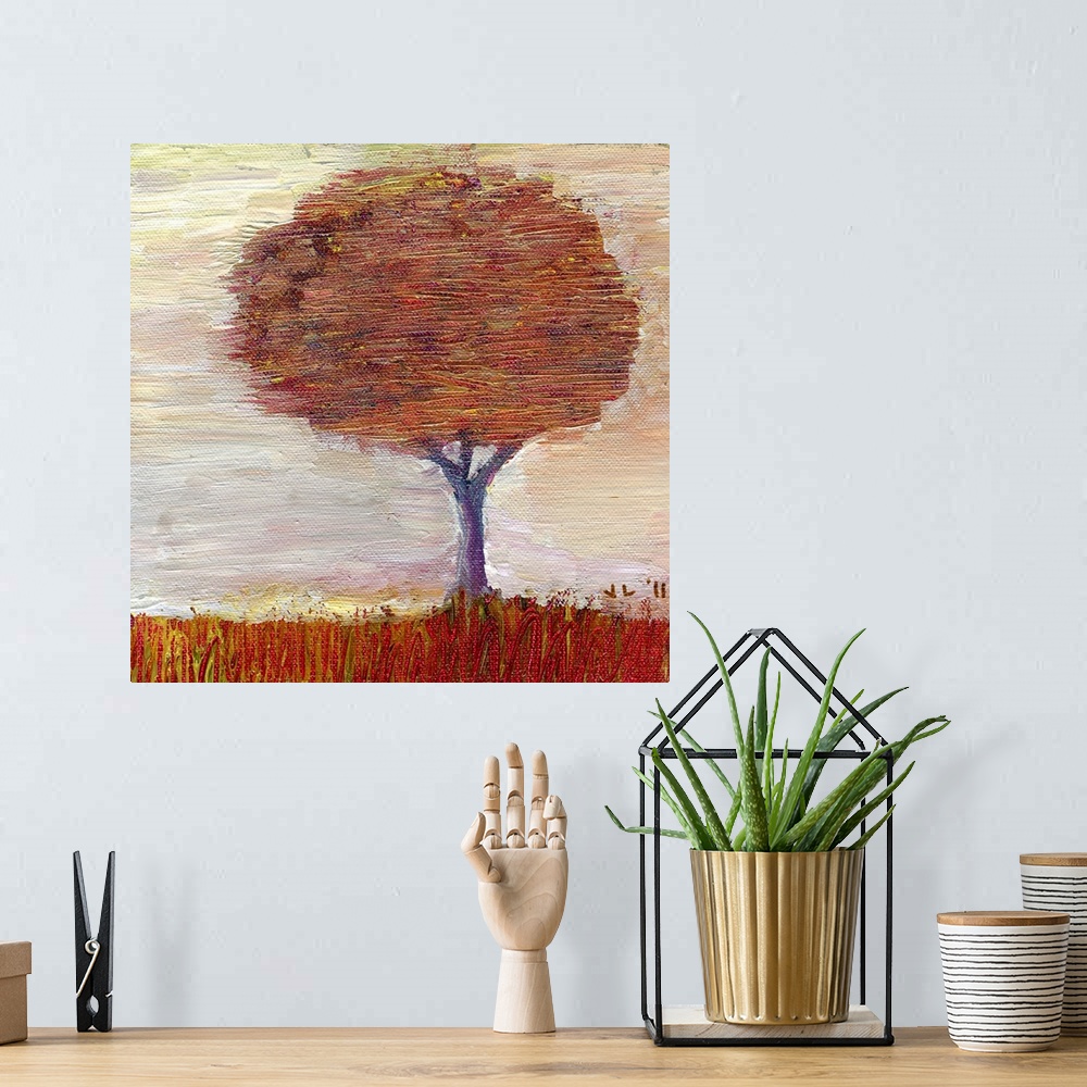 A bohemian room featuring Painting of large tree covered in fall leaves.