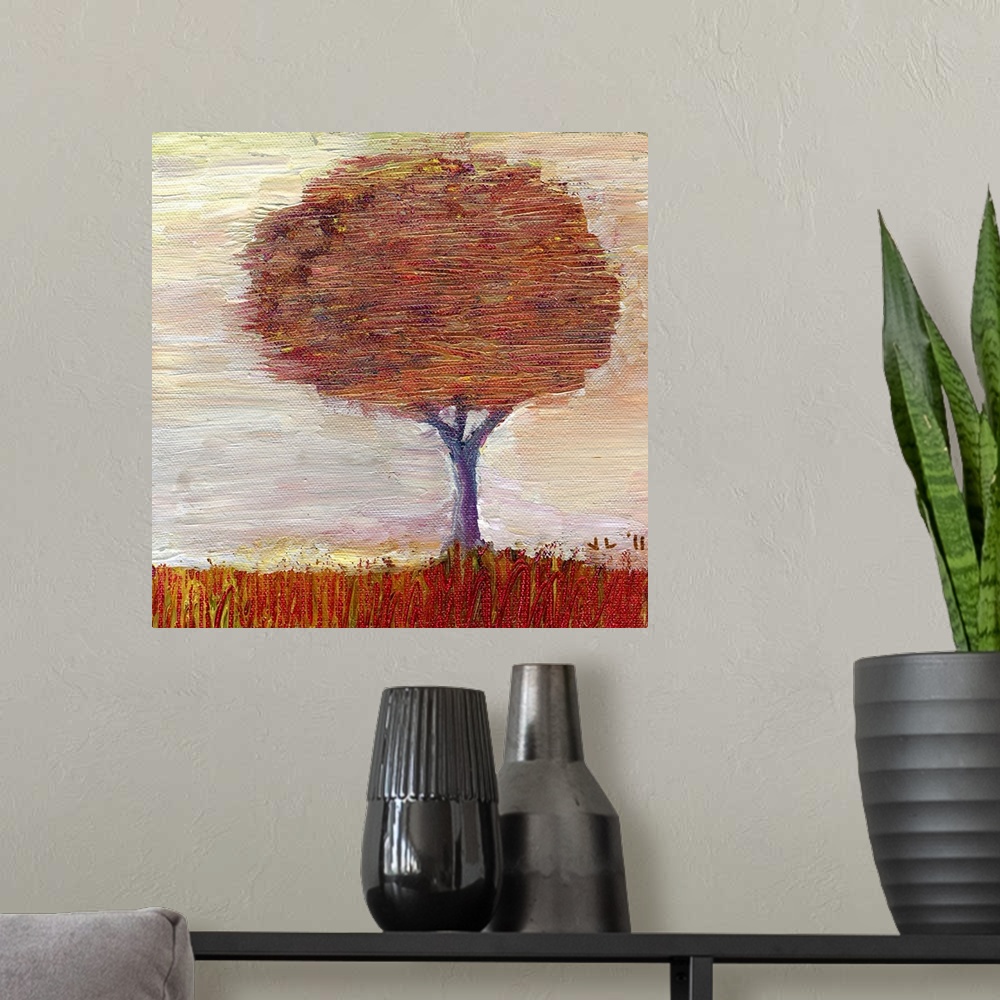 A modern room featuring Painting of large tree covered in fall leaves.
