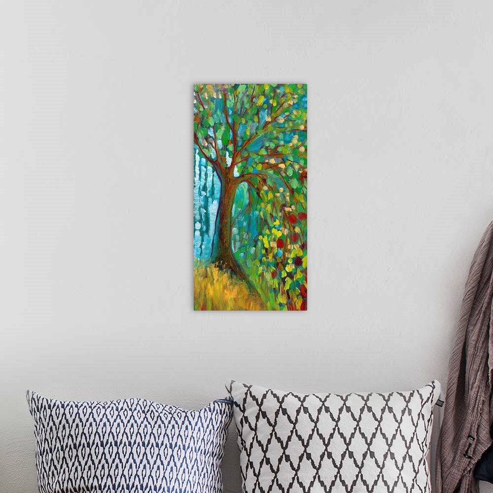 A bohemian room featuring Panoramic contemporary art portrays a lone tree filled with brightly colored leaves sitting on a ...