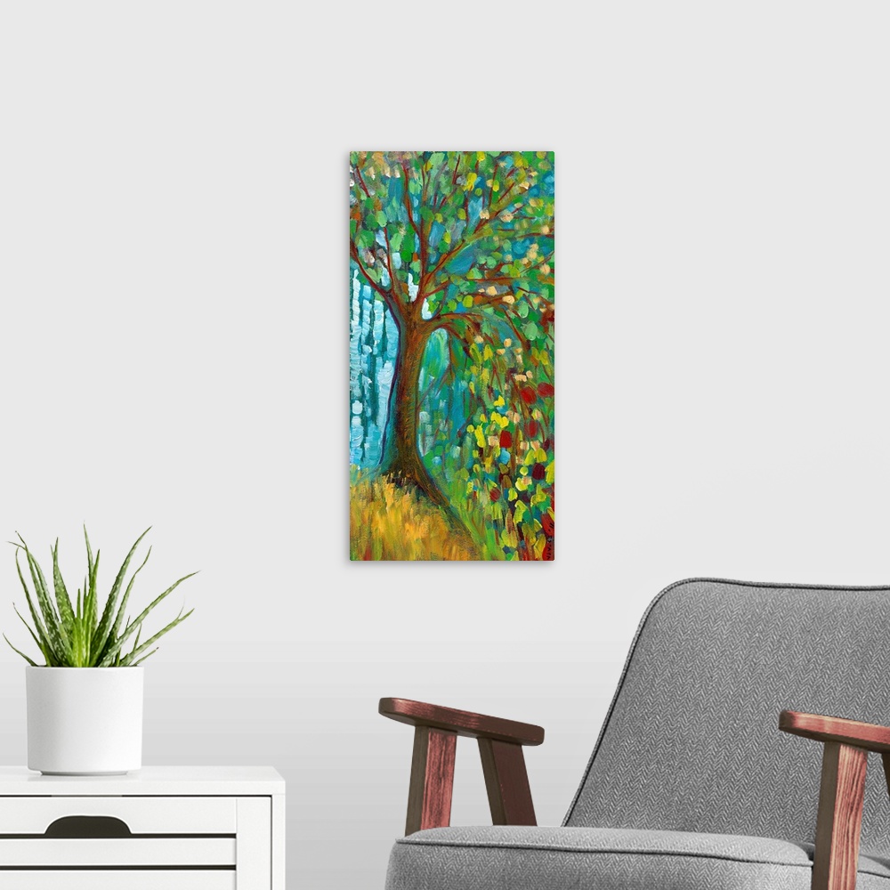 A modern room featuring Panoramic contemporary art portrays a lone tree filled with brightly colored leaves sitting on a ...