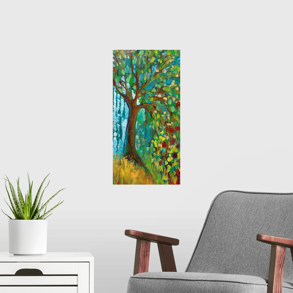 A modern room featuring Panoramic contemporary art portrays a lone tree filled with brightly colored leaves sitting on a ...