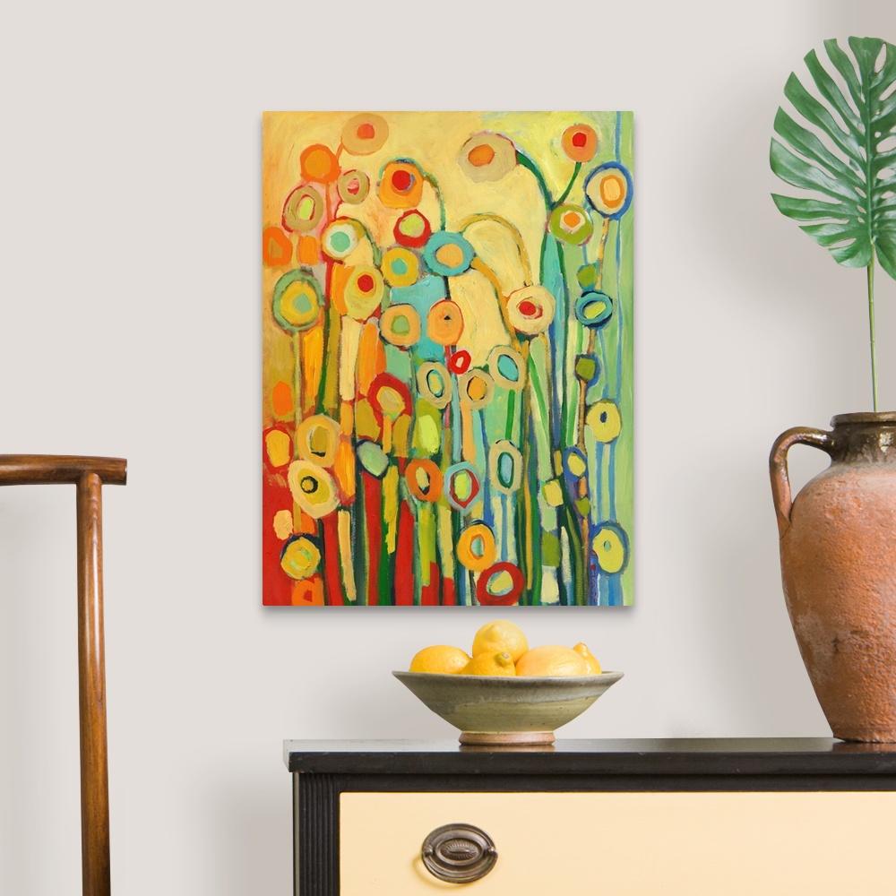 A traditional room featuring Vertical, abstract painting of simplified flower shapes in a kaleidoscope of colors.