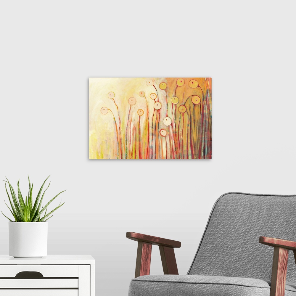 A modern room featuring This horizontal abstract painting shows pastel color flower pods on a radiant backdrop.