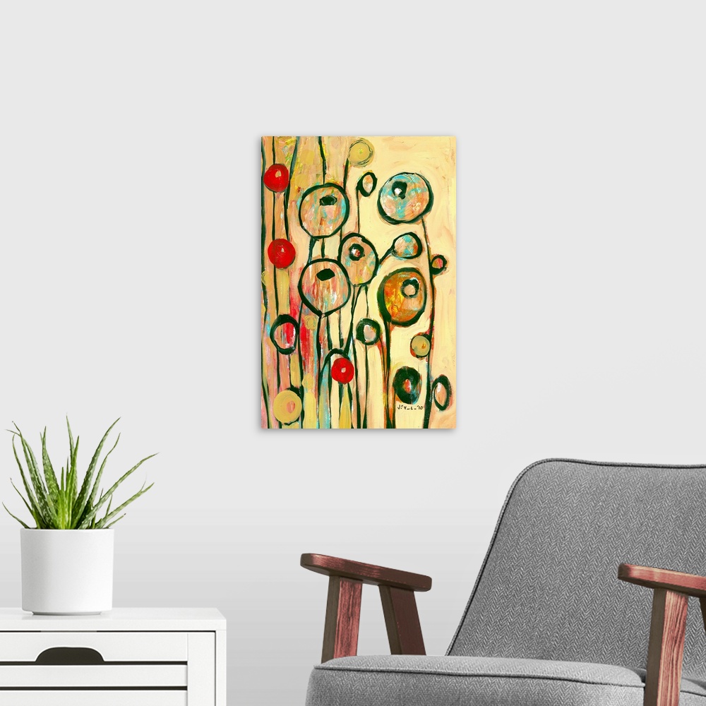 A modern room featuring Large, portrait contemporary art of circular, modern poppy shapes springing upward on a golden, w...