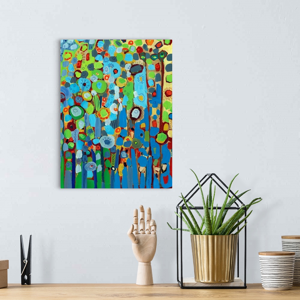A bohemian room featuring Large portrait abstract painting of a variety of circular flowers growing vertically in mainly co...